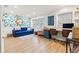 Home office featuring blue and floral decor with built-in shelves and dual desks at 21918 Shamu Dr, Land O Lakes, FL 34639