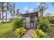 Private outdoor shower features tropical landscaping at 21918 Shamu Dr, Land O Lakes, FL 34639