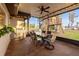 Spacious screened porch with a BBQ area and a dining table for outdoor entertainment and backyard treehouse at 21918 Shamu Dr, Land O Lakes, FL 34639
