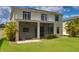 Lovely backyard with screened lanai, balcony, and lush green grass at 2463 Carnation Ct, North Port, FL 34289