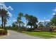 Community entrance with stone monument and landscaped median at 2463 Carnation Ct, North Port, FL 34289