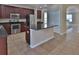 Modern kitchen features granite countertops, dark wood cabinets, and stainless-steel appliances at 2463 Carnation Ct, North Port, FL 34289
