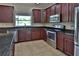 Stylish kitchen with stainless steel appliances and granite countertops at 2463 Carnation Ct, North Port, FL 34289