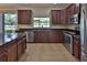 Modern kitchen featuring stainless steel appliances and ample cabinet space at 2463 Carnation Ct, North Port, FL 34289
