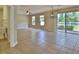The living room offers natural light and sliding glass doors leading to an outdoor patio area at 2463 Carnation Ct, North Port, FL 34289