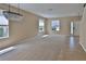Open living room with neutral walls, carpet, and natural light at 2463 Carnation Ct, North Port, FL 34289
