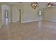 Neutral-toned living room showcasing archways and an open-concept design, creating a spacious and inviting atmosphere at 2463 Carnation Ct, North Port, FL 34289