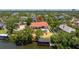 A beautiful waterfront home is shown with a pool and private dock with boat lift at 2613 N Dundee St, Tampa, FL 33629