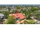 An aerial view showcasing a luxury waterfront home surrounded by lush landscaping and a serene bay, exemplifying upscale living at 2613 N Dundee St, Tampa, FL 33629