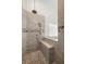 Spacious shower offers bench seating, a shower wand, a showerhead and unique decorative tile at 2613 N Dundee St, Tampa, FL 33629