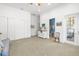 Bright bedroom featuring an ensuite bathroom, door to patio, and plenty of closet space at 2613 N Dundee St, Tampa, FL 33629