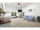 Bright bonus room with large windows, comfortable seating, and space for exercise equipment at 2613 N Dundee St, Tampa, FL 33629