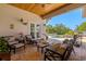 Charming covered patio with comfortable seating and scenic views of the lush pool area at 2613 N Dundee St, Tampa, FL 33629