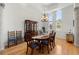 Elegant dining room featuring hardwood floors, chandelier, and large windows at 2613 N Dundee St, Tampa, FL 33629