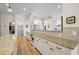 Hallway featuring wainscoting with granite counters on serving buffet with hardwood floors at 2613 N Dundee St, Tampa, FL 33629
