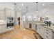 Well-lit kitchen with granite countertops, a built-in oven, and ample cabinetry at 2613 N Dundee St, Tampa, FL 33629