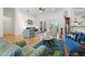 Bright living room with hardwood floors, plush furniture, and views of the home's well-lit interior at 2613 N Dundee St, Tampa, FL 33629