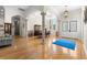 Expansive living area featuring hardwood floors, columns, and detailed millwork, showcasing elegance and space at 2613 N Dundee St, Tampa, FL 33629