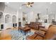 Inviting living room featuring built-in shelving and opening up into the home's kitchen at 2613 N Dundee St, Tampa, FL 33629