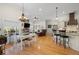 Spacious living area with hardwood floors, a fireplace, and open to the kitchen at 2613 N Dundee St, Tampa, FL 33629