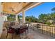 A covered outdoor patio is the perfect space for dining or relaxing by the pool at 2613 N Dundee St, Tampa, FL 33629