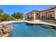 Beautiful pool area with stone features and landscaping, perfect for outdoor enjoyment at 2613 N Dundee St, Tampa, FL 33629