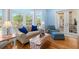 Bright and sunny sitting area with large windows offering serene views of the outdoor pool at 2613 N Dundee St, Tampa, FL 33629