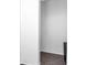Hallway with dark flooring, neutral walls and trim at 2719 Boca Ciega N Dr, St Petersburg, FL 33710