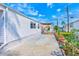 Spacious backyard with a concrete patio, outdoor seating, and well-maintained landscaping at 27466 Us Highway 19 N # 56, Clearwater, FL 33761