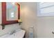 Cozy bathroom with a wood-framed mirror, vanity, and charming accents at 27466 Us Highway 19 N # 56, Clearwater, FL 33761