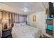 Relaxing bedroom with a comfortable bed, side table, window, and storage shelves at 27466 Us Highway 19 N # 56, Clearwater, FL 33761