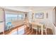 Inviting dining room with hardwood floors and a large window at 27466 Us Highway 19 N # 56, Clearwater, FL 33761
