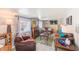 Cozy living room with a fireplace, comfortable seating, and a television at 27466 Us Highway 19 N # 56, Clearwater, FL 33761