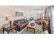 Bright living room with comfortable seating, stylish decor, and ample natural light at 27466 Us Highway 19 N # 56, Clearwater, FL 33761