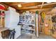 Storage room with a stacked washer and dryer along with ample shelving and storage containers at 27466 Us Highway 19 N # 56, Clearwater, FL 33761