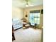 Bright Bedroom with a ceiling fan, natural light, and a crib at 2776 Golf Lake Dr # 1, Plant City, FL 33566