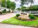 Laurel Lake Community entrance featuring flowers and a brick paver driveway at 2776 Golf Lake Dr # 1, Plant City, FL 33566