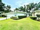 Lovely home exterior with a well-maintained lawn and manicured shrubbery in a peaceful setting at 2776 Golf Lake Dr # 1, Plant City, FL 33566