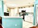 Bright kitchen featuring ample counter space, modern appliances, and a tiled backsplash at 2776 Golf Lake Dr # 1, Plant City, FL 33566
