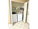 Efficient laundry room with front load washer and dryer, plus storage shelf at 2776 Golf Lake Dr # 1, Plant City, FL 33566