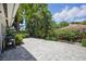 Paver patio and tropical landscaping create a private backyard retreat at 301 62Nd S Ave, St Petersburg, FL 33705