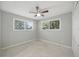 Bright, airy bedroom with neutral walls, lots of light, and a ceiling fan at 301 62Nd S Ave, St Petersburg, FL 33705
