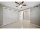 Clean bedroom featuring light gray walls, and double door closet and bright white trim at 301 62Nd S Ave, St Petersburg, FL 33705