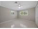 Bright, airy bedroom with neutral walls, a ceiling fan, and bright natural light at 301 62Nd S Ave, St Petersburg, FL 33705