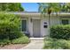 Inviting front entrance with well-maintained landscaping and a stylish front door at 301 62Nd S Ave, St Petersburg, FL 33705