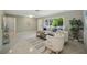 Inviting living room with a comfortable seating area and serene views from a large window at 301 62Nd S Ave, St Petersburg, FL 33705
