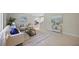 Spacious living room with neutral tones, elegant decor, and views to the kitchen at 301 62Nd S Ave, St Petersburg, FL 33705