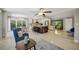 Open concept living room flows to the kitchen with a large island, bar seating, and ample space at 301 62Nd S Ave, St Petersburg, FL 33705