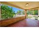 This expansive front porch features a brick base and bright red floorboards at 3100 11Th N Ave, St Petersburg, FL 33713