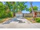 Large detached two-car garage with ample parking space and mature trees at 3100 11Th N Ave, St Petersburg, FL 33713